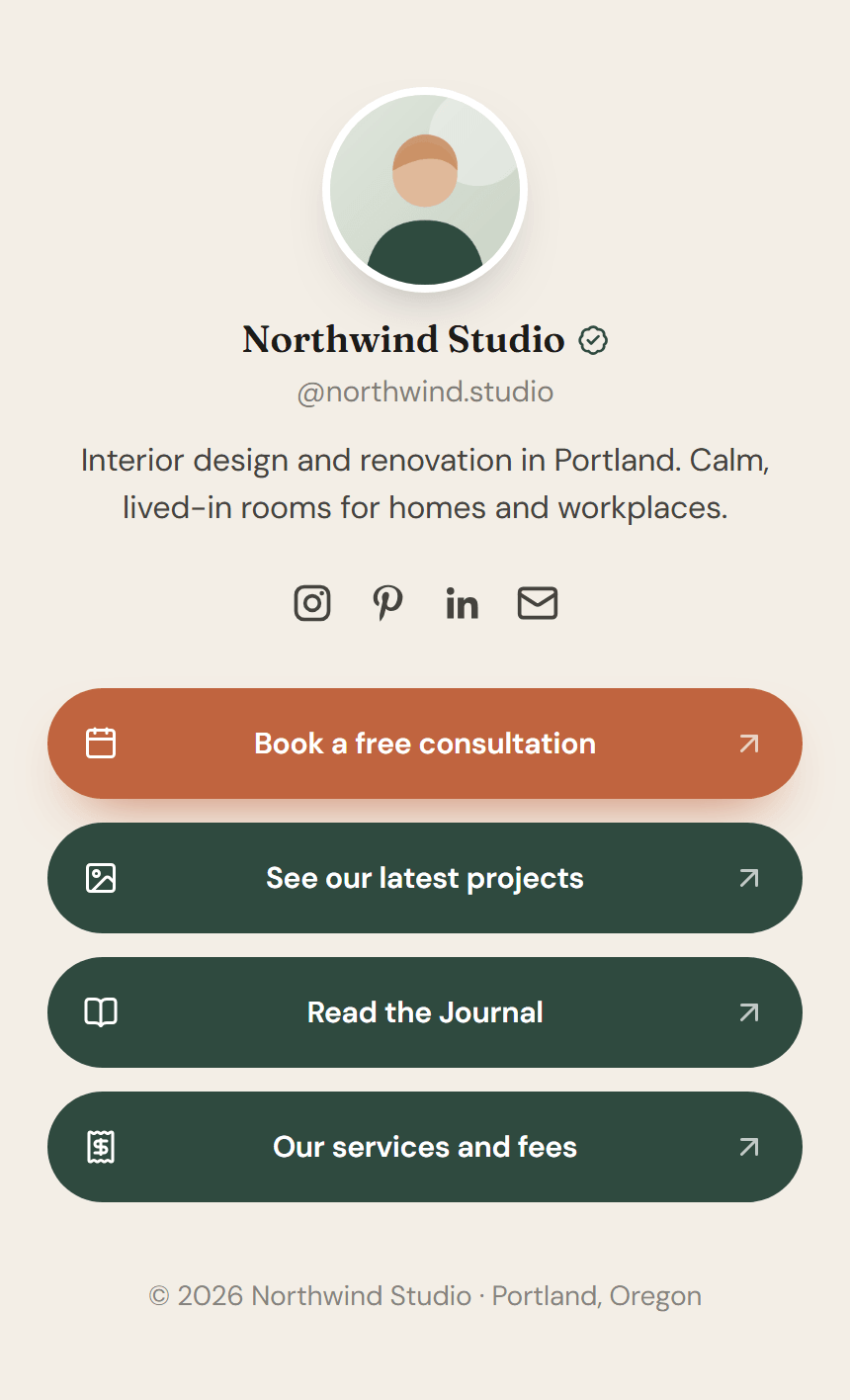 A narrow phone-sized page with a round portrait, the name Northwind Studio with a verified badge, a handle, a short bio, four social icons and four large rounded link buttons, the first one in orange